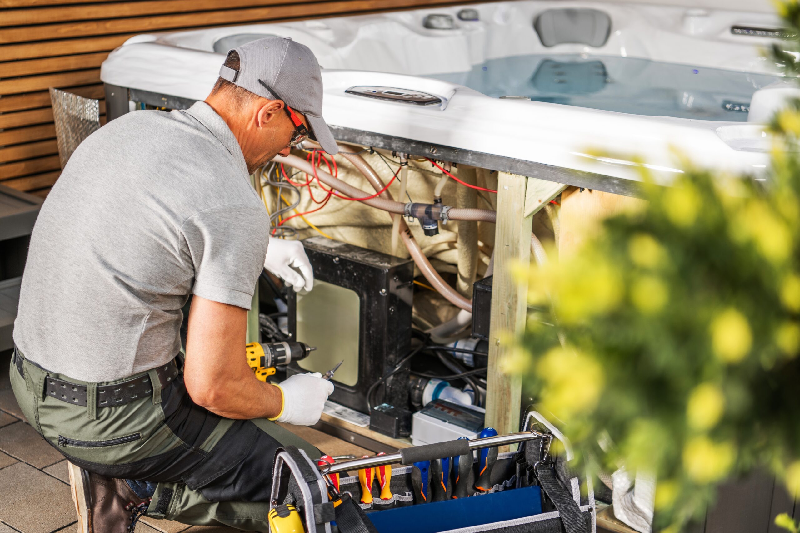 electrician performing professional electrical wiring installation safely in a home